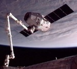 Dragon grappled by ISS on COTS C2+ mission (NASA)