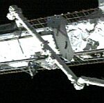 STS-113: station arm installs P1 truss (NASA)