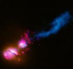 Black hole energy beam in 3C321 (NASA)