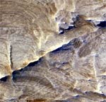 MRO image of halos in rock fractures (NASA/JPL/Univ. of Arizona)