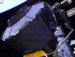 Quest being lifted out of airlock during STS-104 EVA (NASA)