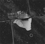 STS-118: tile gouge on underside of shuttle (NASA)